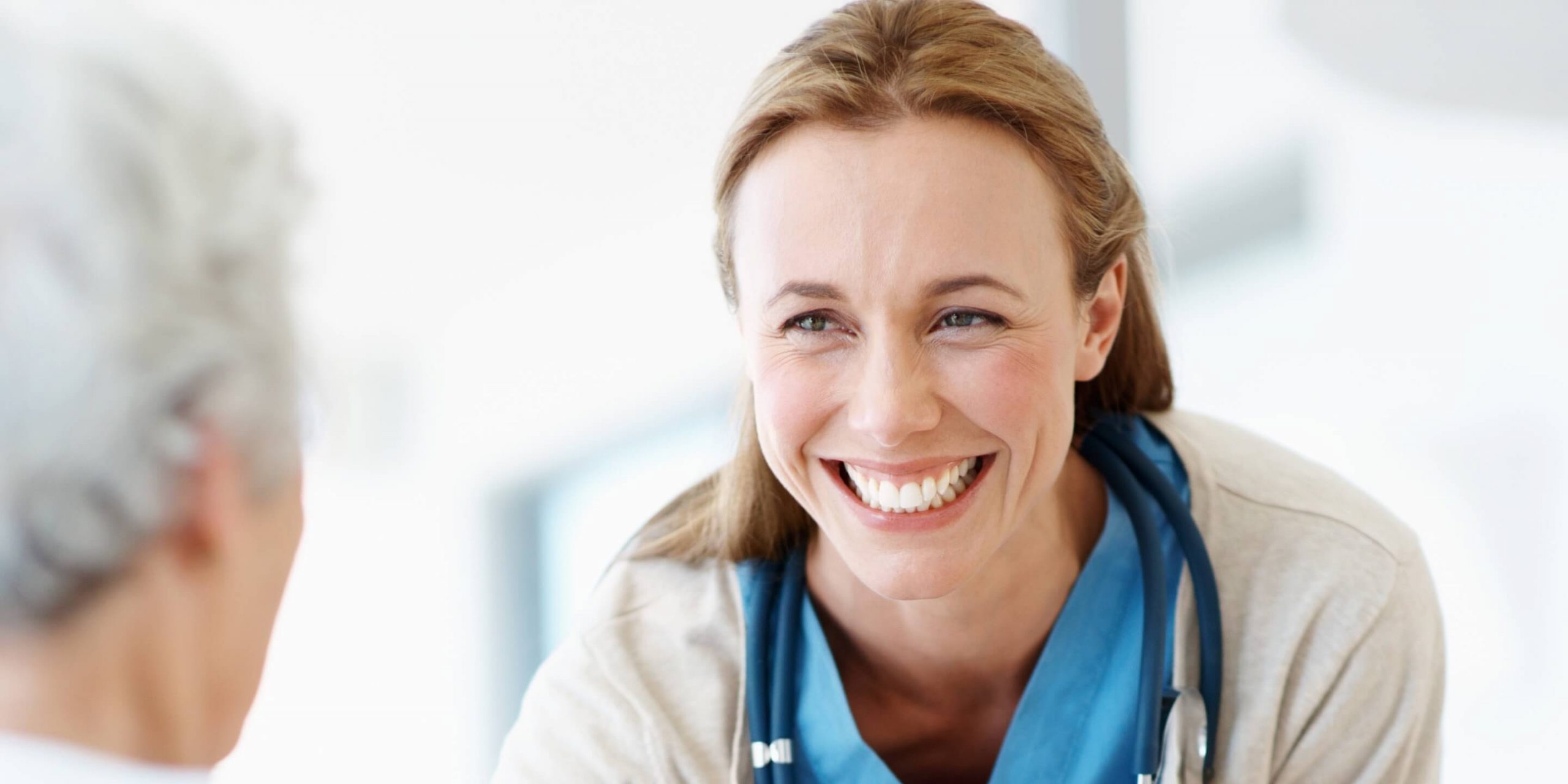 Doctor smiling at patient